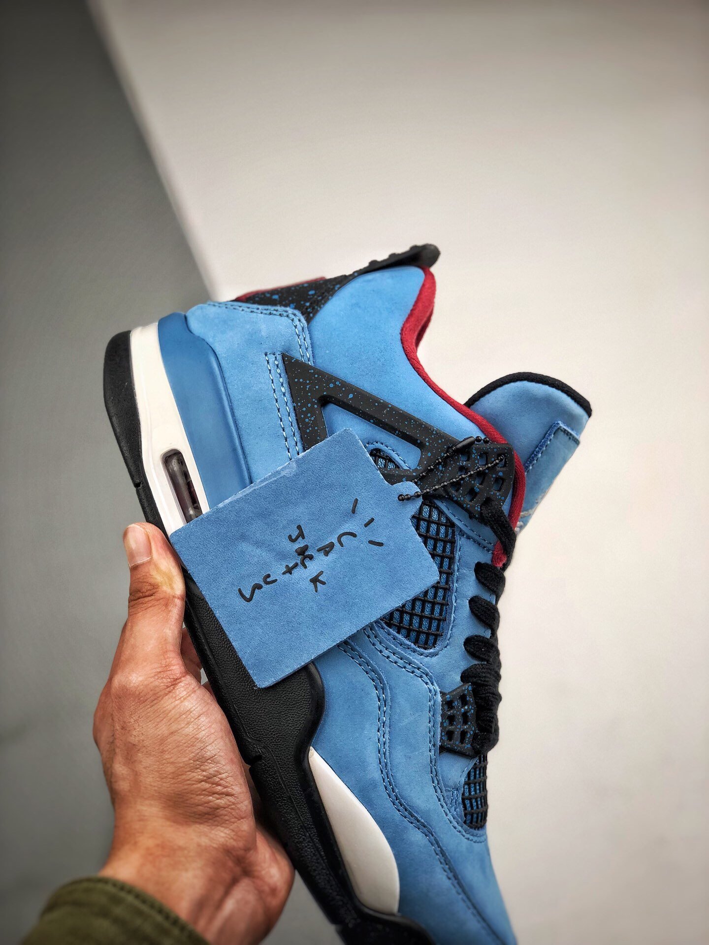 Travis Scott's X Air Jordan 4 Cactus Jack Oliers University Blue 15